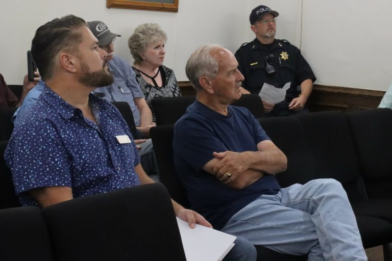 Mayor Pro-Tem Chip Joslin, left, sits in the audience section of Glen Rose City Council Chambers during public comment regarding a lawsuit he filed against the city and City Administrator Michael Leamons. (Ann Powers Photo)
